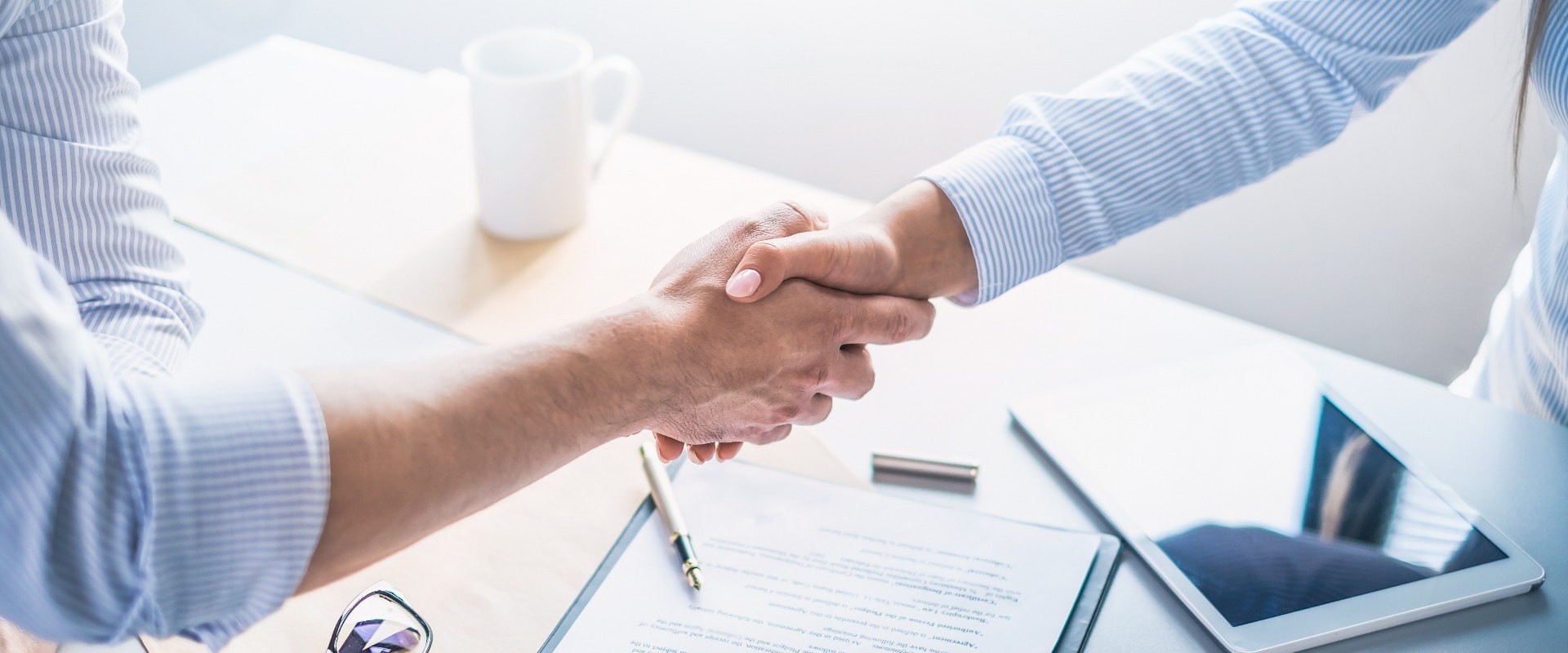 Business people shaking hands, finishing up meeting.